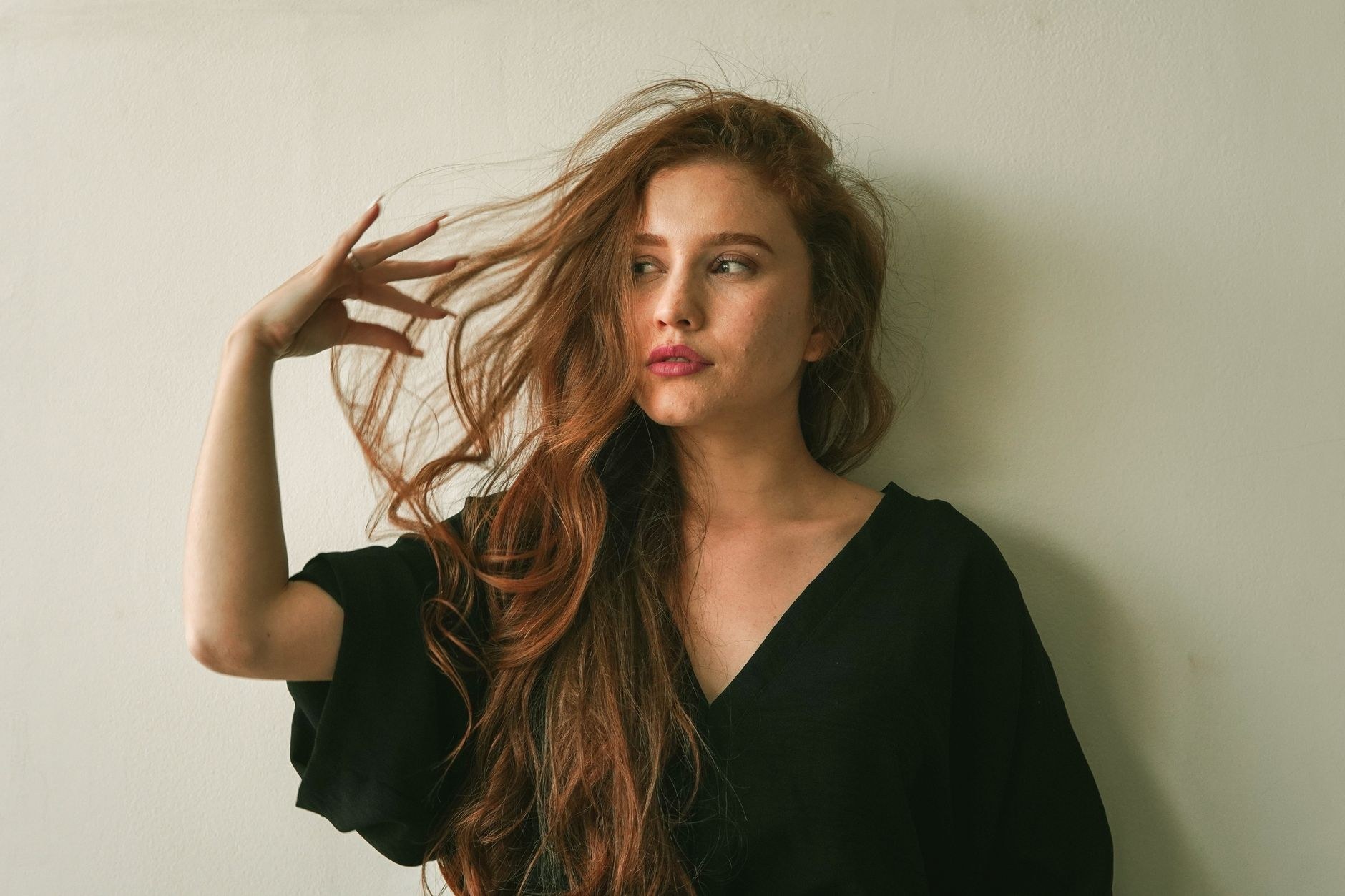 Long auburn waves, editorial portrait