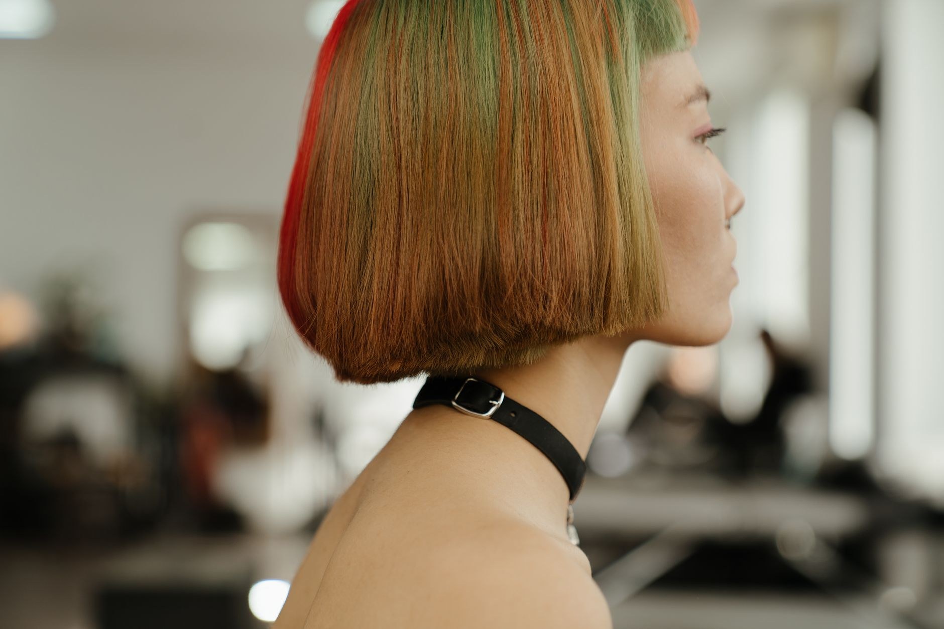 Freshly coloured bob in side profile inside the salon